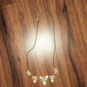 Gold necklace with sparkly white pieces